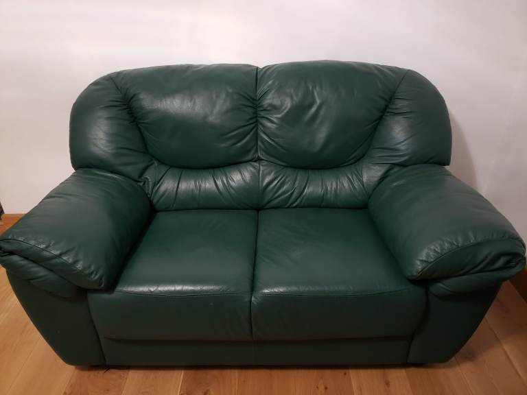 Two green leather sofas  (one of them for free) Delivery possible.