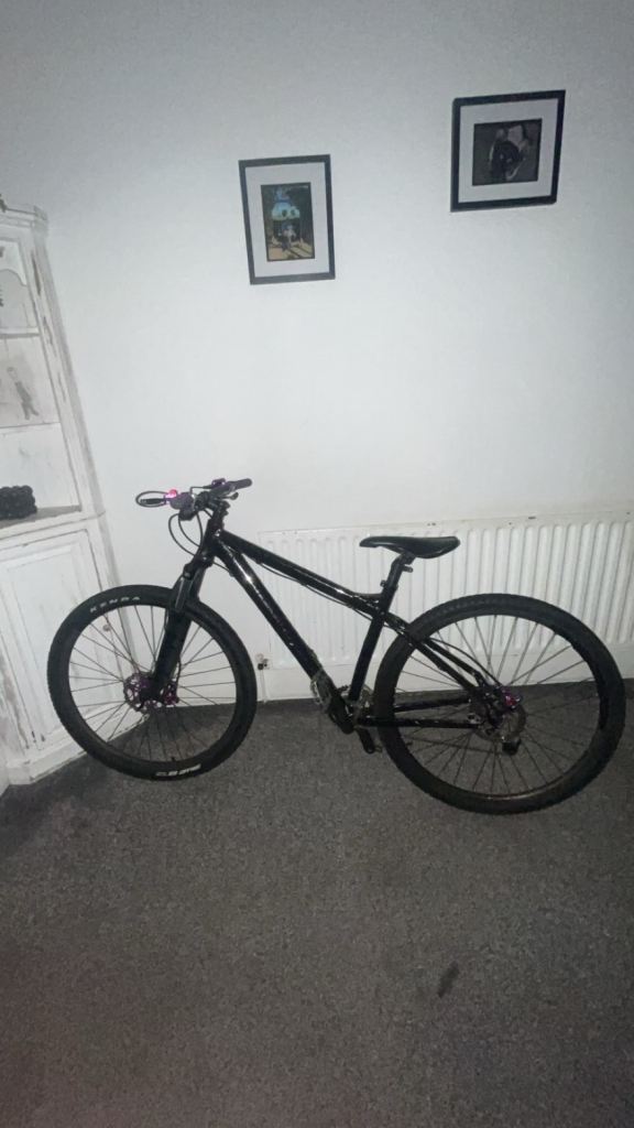 Black Mountain Bike with Purple Details – Good Condition
