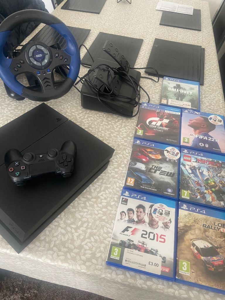 PS4 Bundle + Steering Wheel & Pedals + 7 Games – Excellent Condition