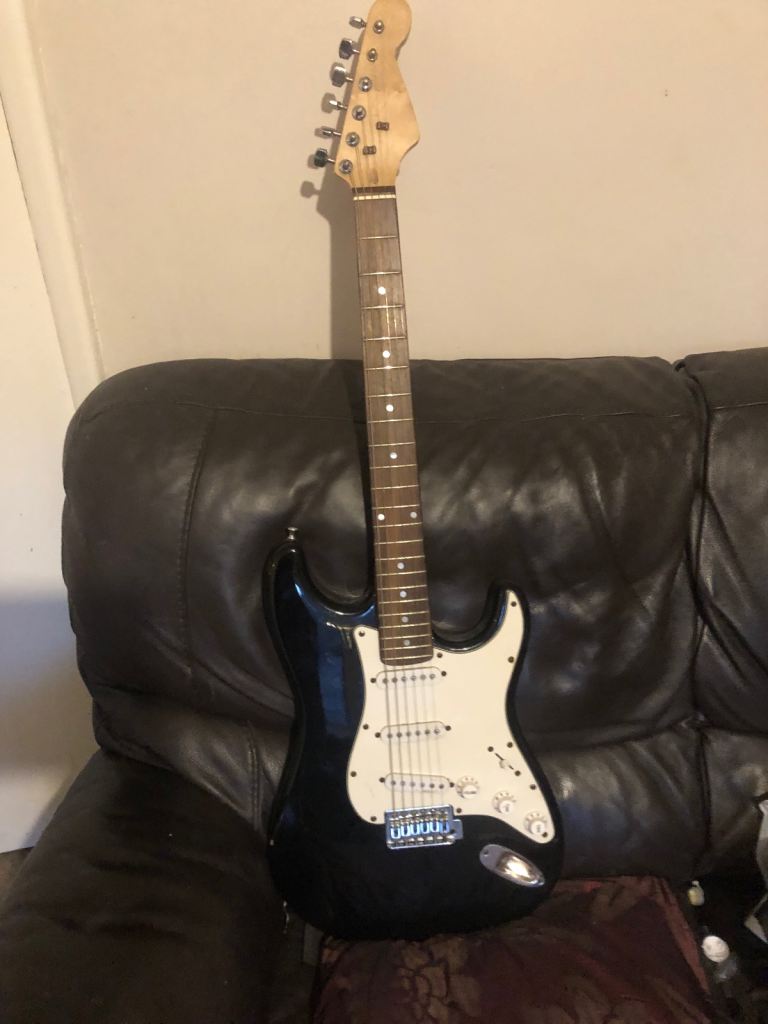Black Stratocaster guitar