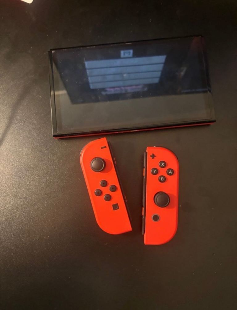 Nintendo Switch Console with Red Joy-Cons and Bowser Controller