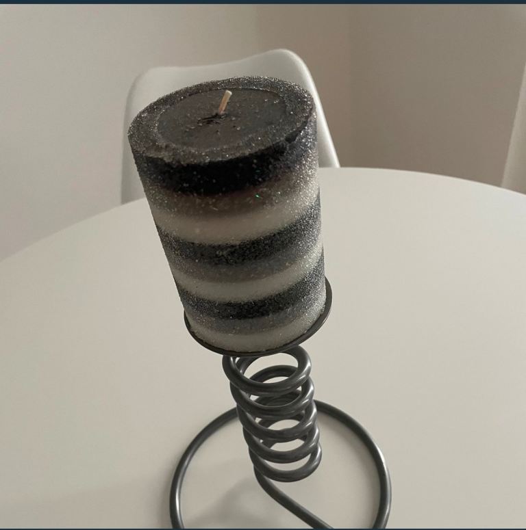 Gunmetal grey candle stick and large candle 