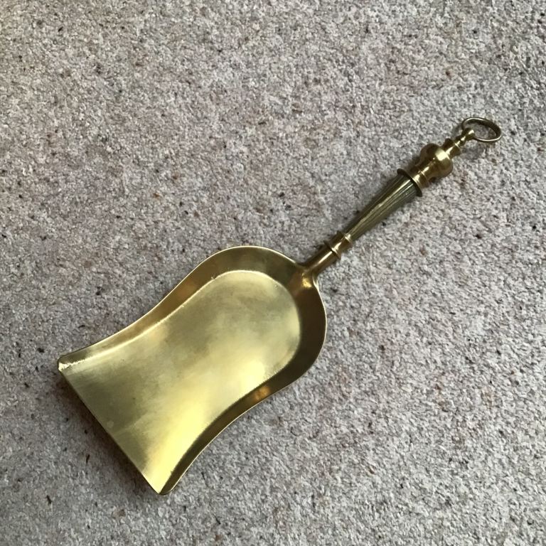 Solid brass ornate fireside shovel. 