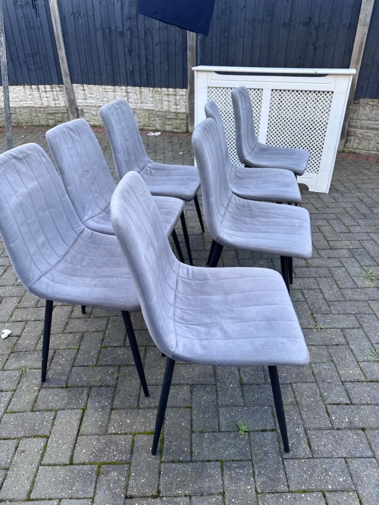 Grey dinning chairs 7 good condition 