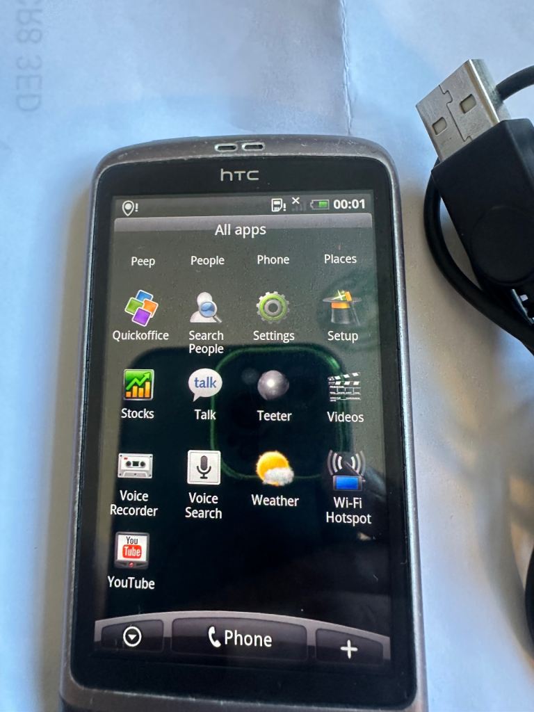 HTC Smartphone with USB Cable – Good Condition