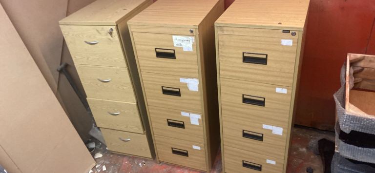 Three wooden filing cabinet