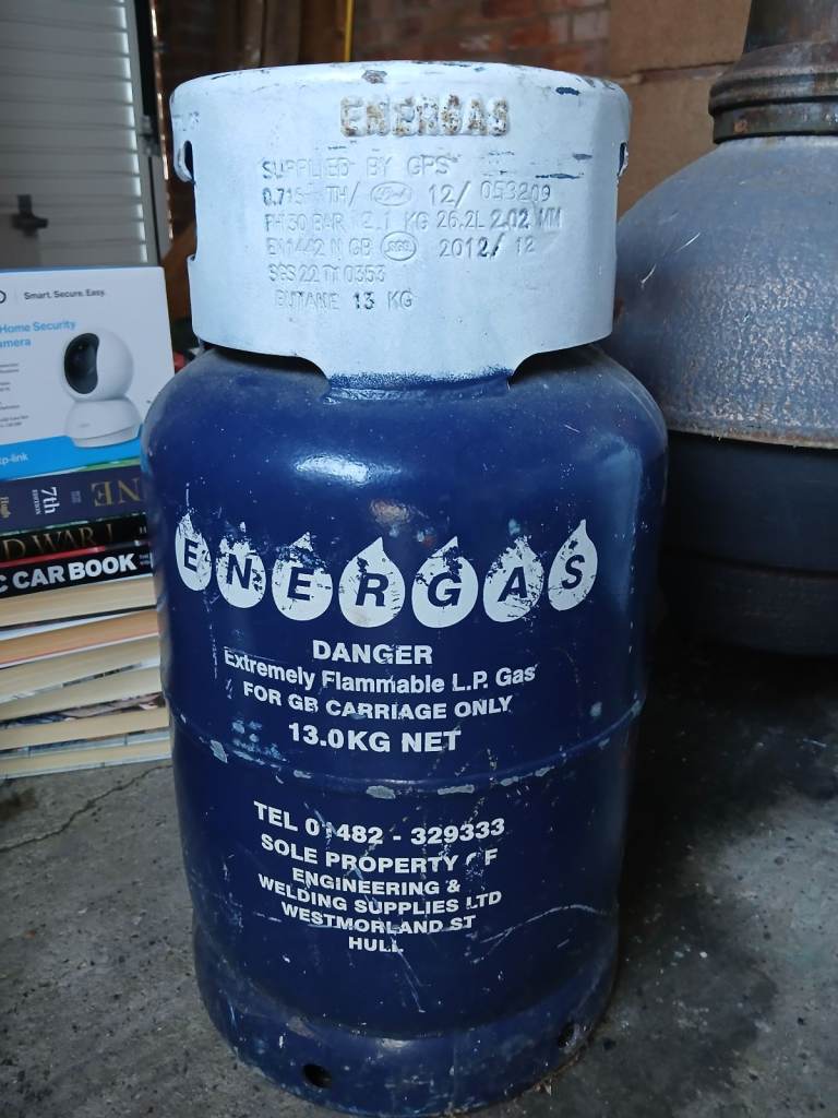 Gas bottle, coins, medal