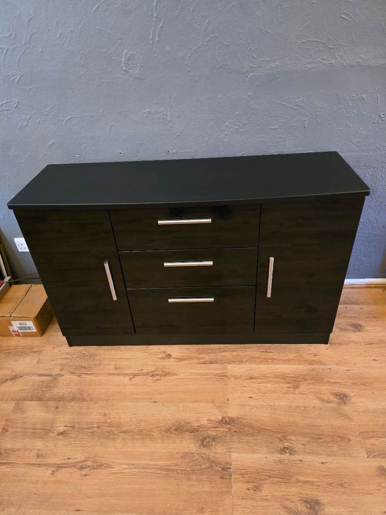 Gloss black sideboard 2 cupboards 3 drawers as new cost nearly £500.00