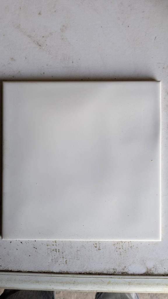 Approx 50 White ceramic wall tiles 200mm by 200mm