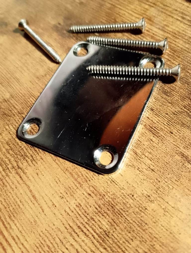 Guitar neck plate