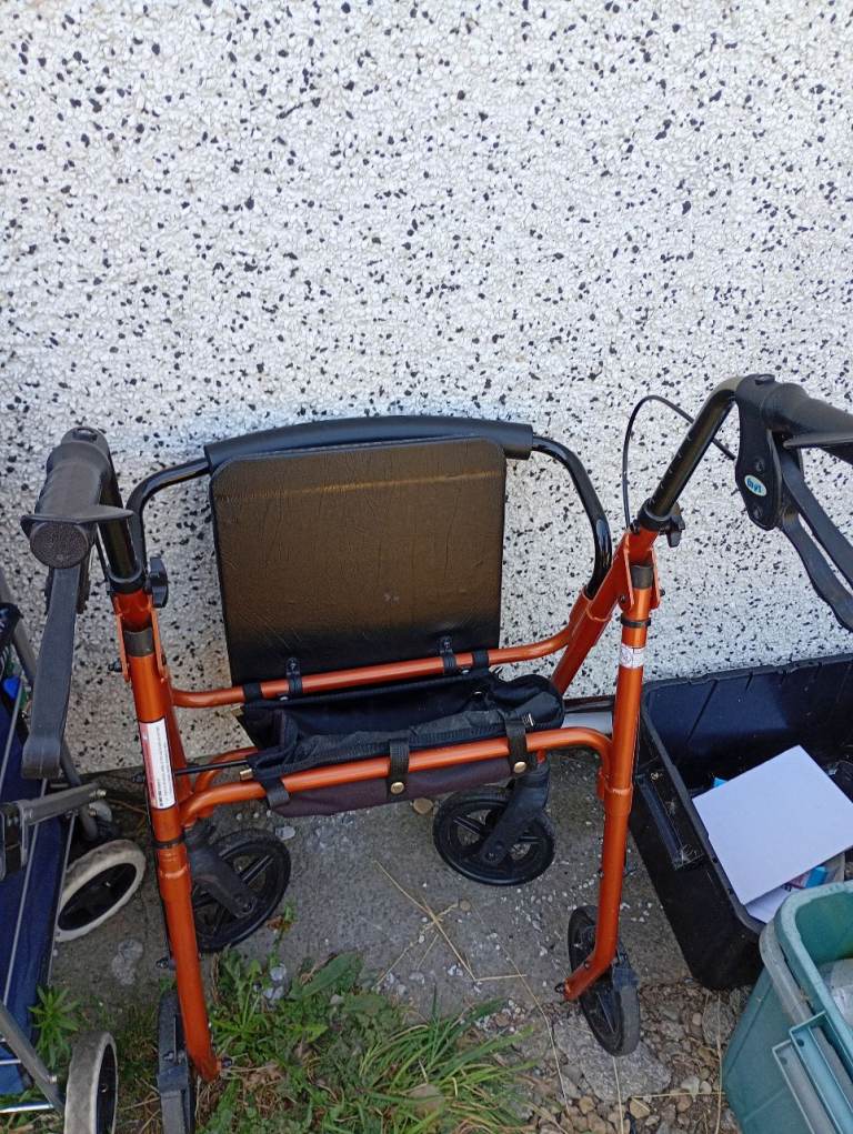 Orange Mobility Walker with Seat and Storage – Good Condition