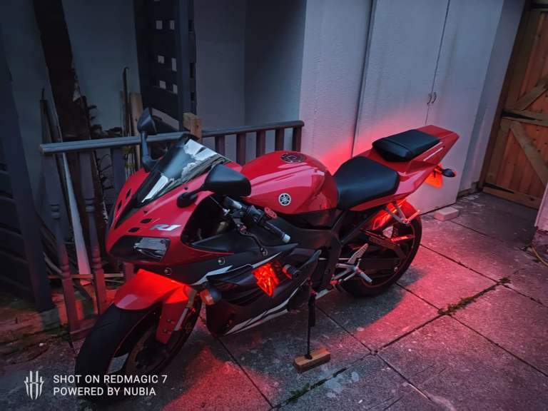  red and black Yamaha YZF-R1 motorcycle, specifically a 2004 model