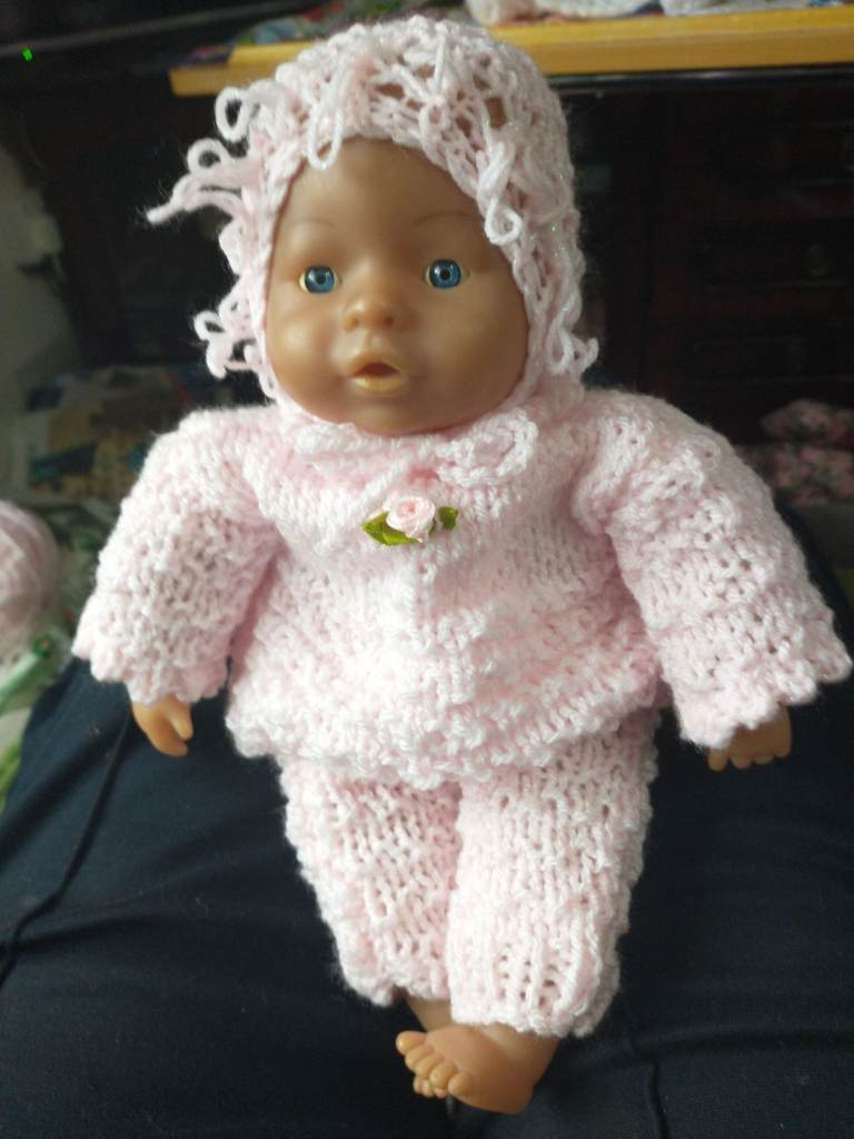 Baby doll in pink new hand knitted garments