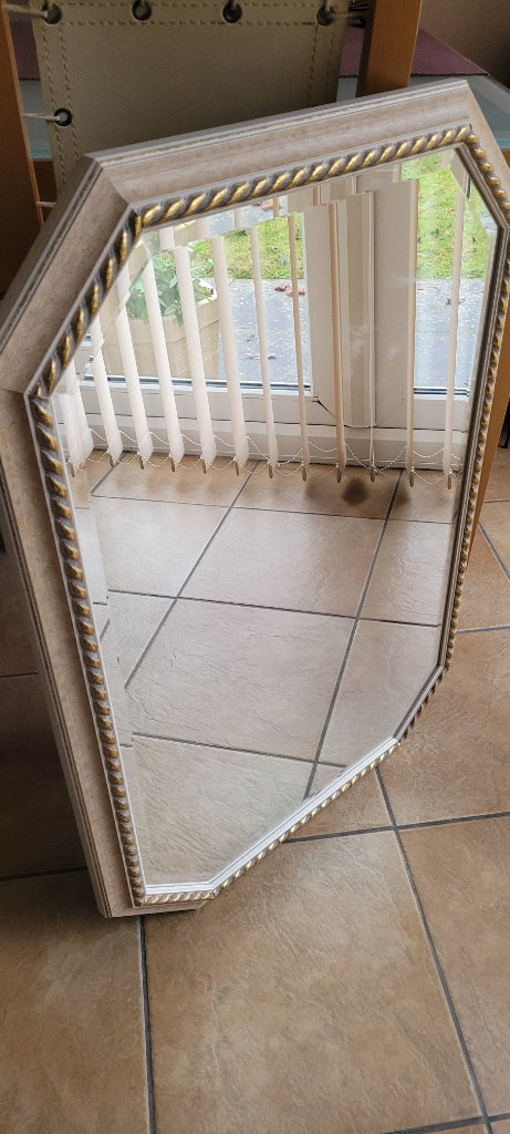 Large cream and gold ornamental mirror. Around 3' tall and 18 inches wide