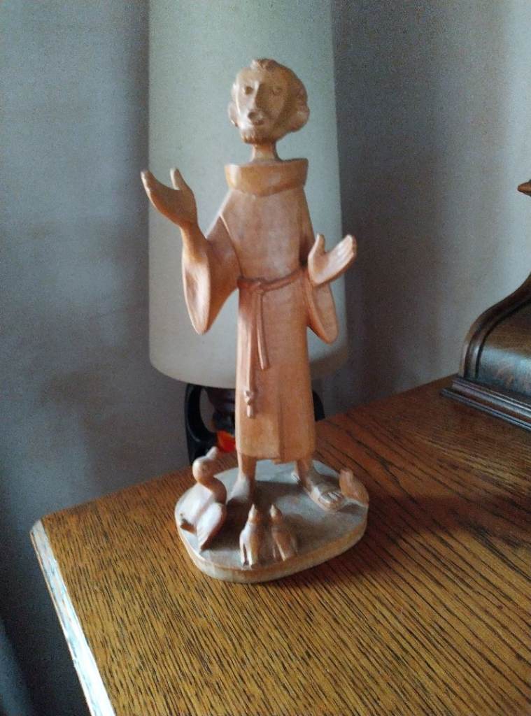 Wooden Seated angel and singing monk