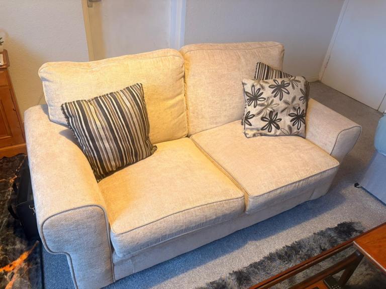 Comfortable Beige Two-Seater Sofa – Good Condition