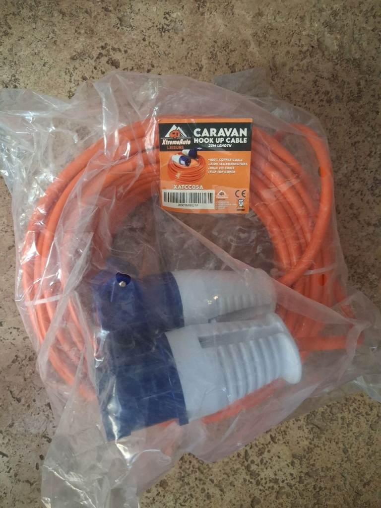 230v 25 Meters extension lead, an 230v to 3 pin plug adaptor 