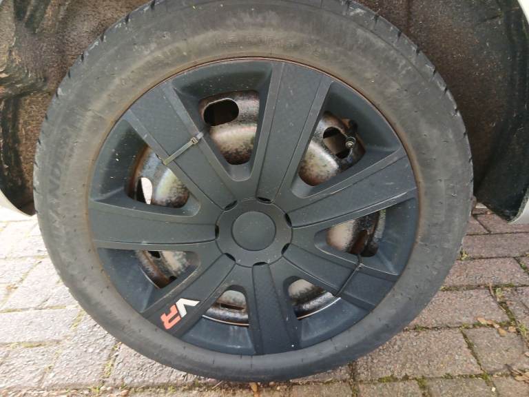 SET OF 4 BLACK 15" WHEEL TRIMS, GOOD CONDITION.