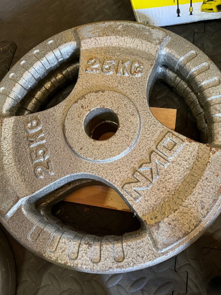 Pair of 25kg cast iron Olympic gym weights /weight plates.