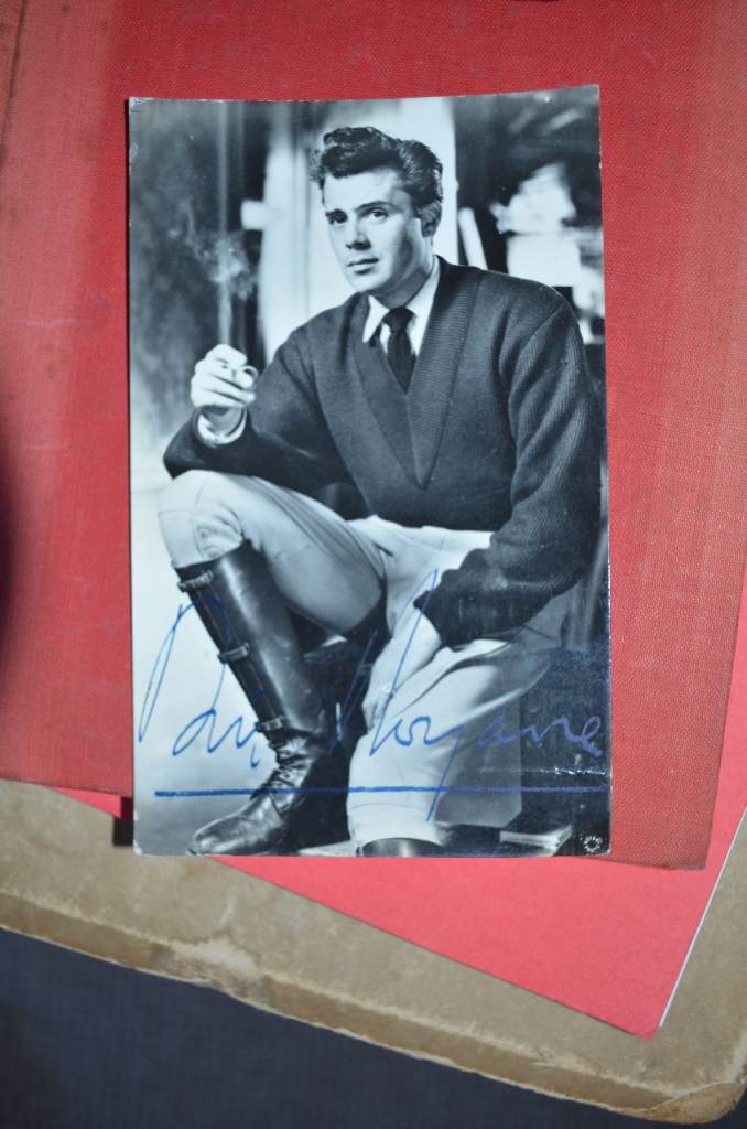 Genuine hand signed POSTCARD photograph of Sir Dirk Bogarde.
