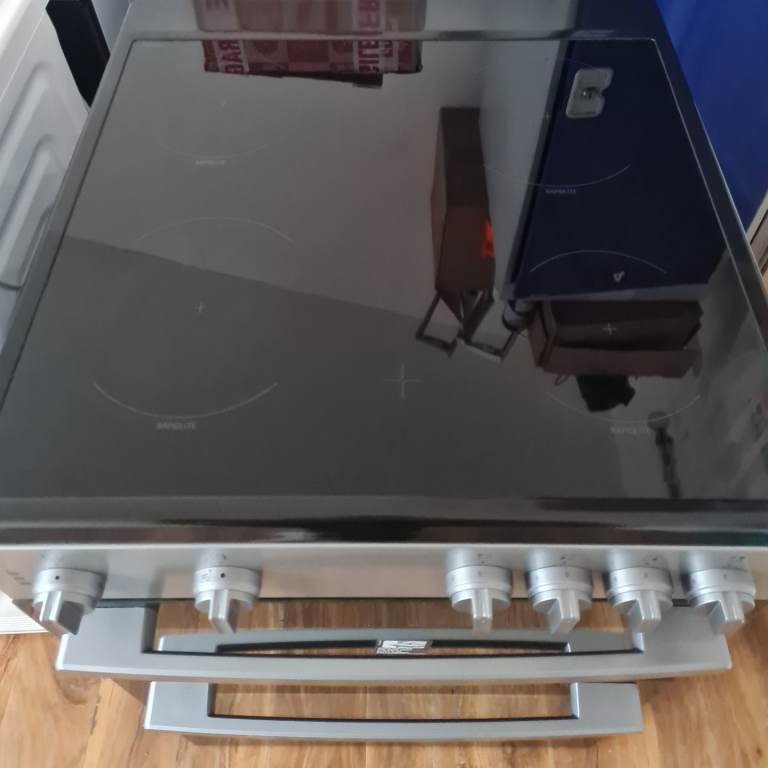 Logik freestanding electric cooker silver 60cm wide 