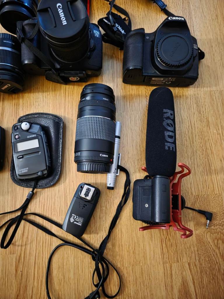 2 canon cameras with loads of accessories.