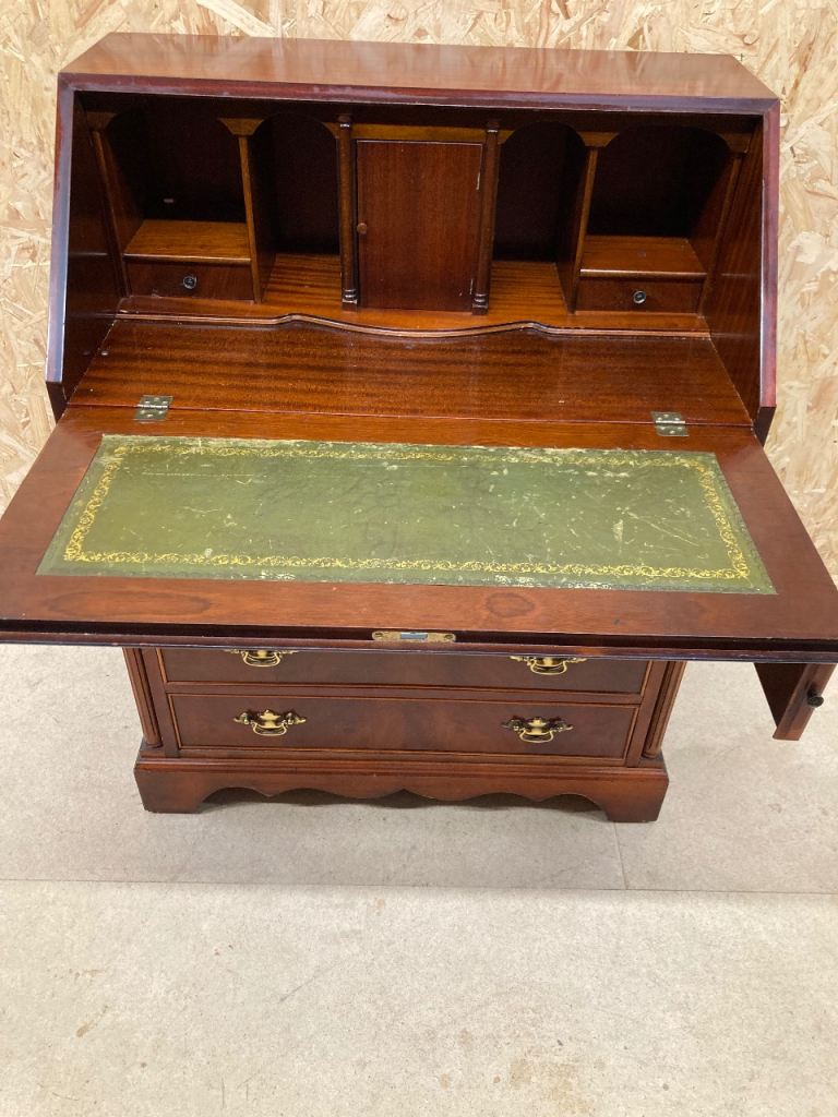 Delivery can be arranged.  Mahogany writing bureau.