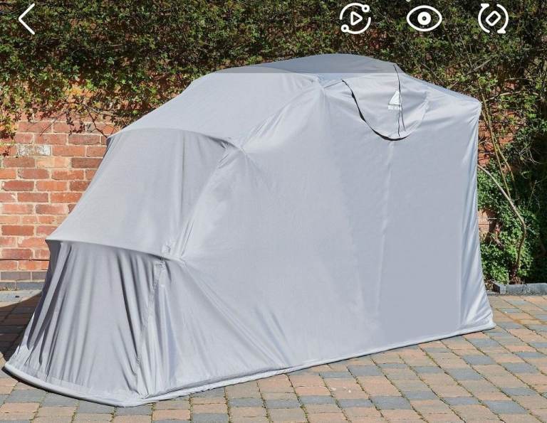 Motorcycle outside tent cover