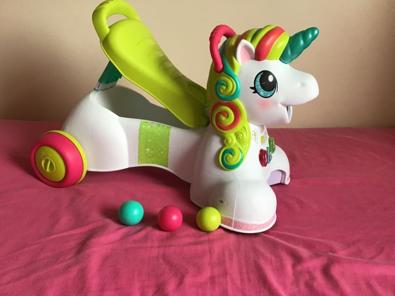 Baby walker /push along / sit on unicorn activities . Sounds , music , flashing lights £15 