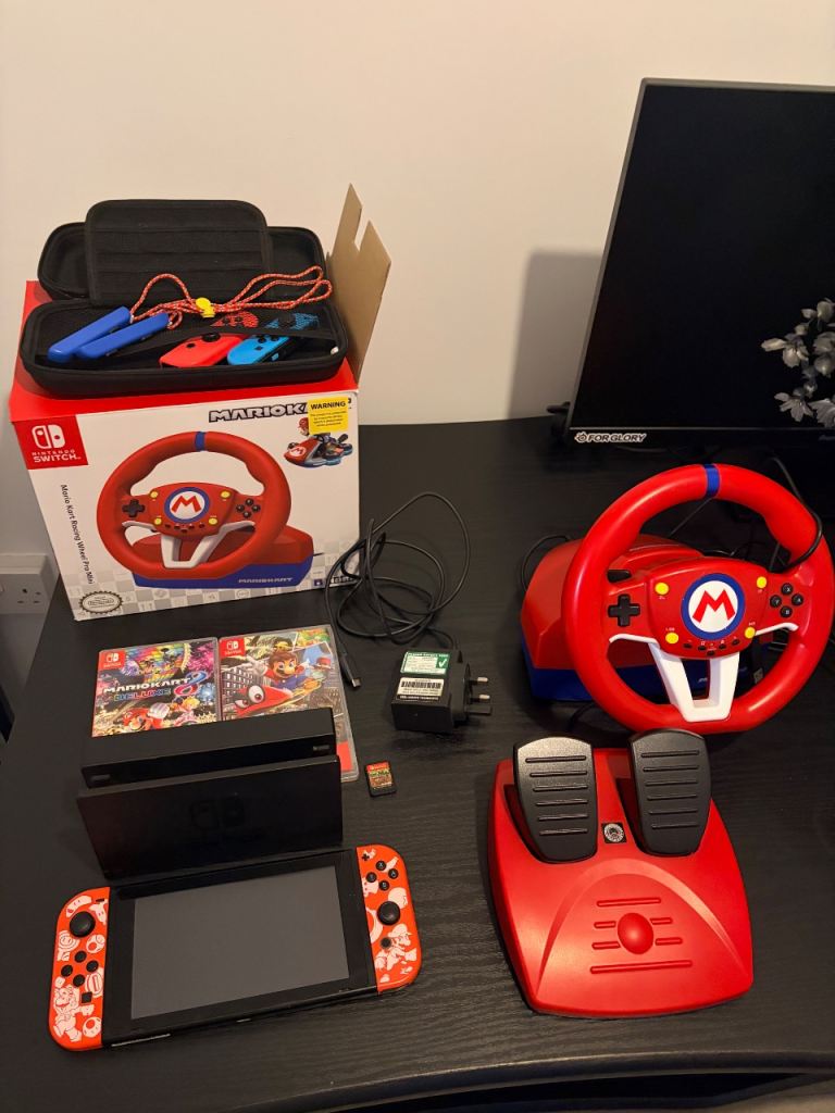 Nintendo Switch Bundle with Mario Kart Wheel and Games
