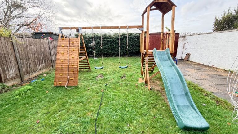 Outdoor play set with swings, slide and a climbing frame 