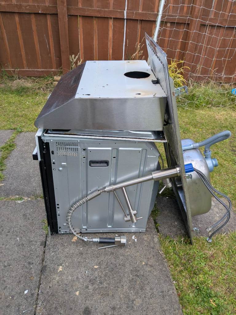 Free Integrated Electric Oven and Hood along with kitchen sink and tap