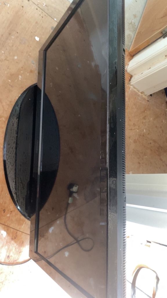 Flat Screen TV with Stand – Good Condition