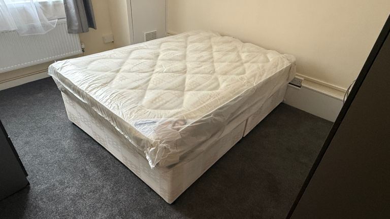 A Double Bed with Mattress 