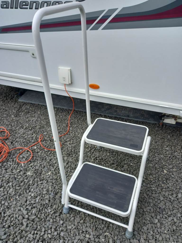 Caravan step with handrail