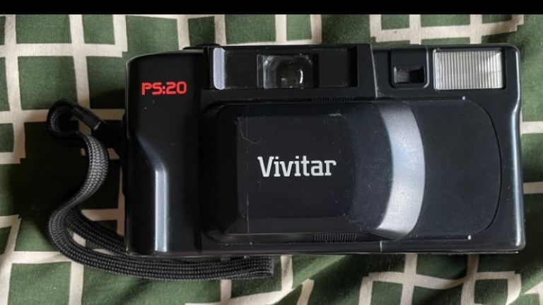 This is a black Vivitar PS:20 point-and-shoot 35mm film camera
