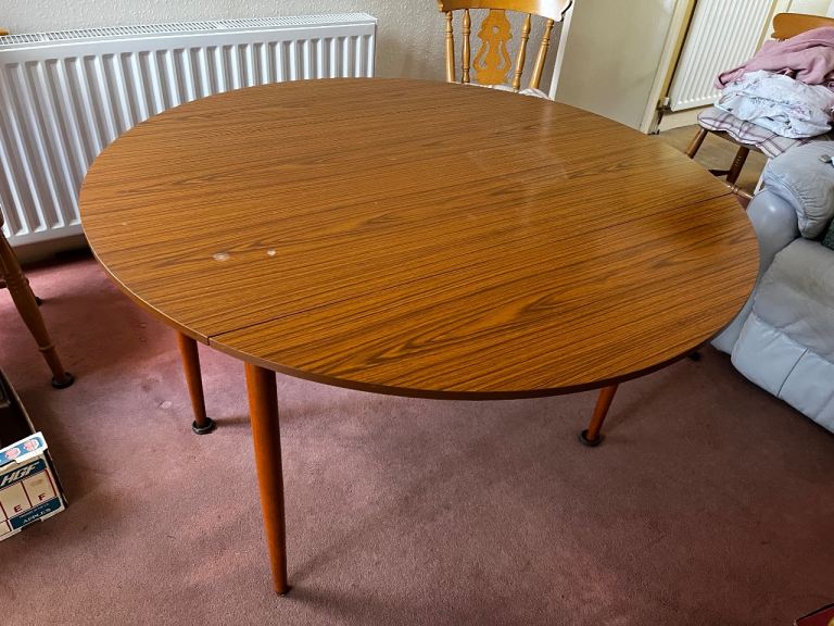 FREE.      Drop leaf table and four chairs