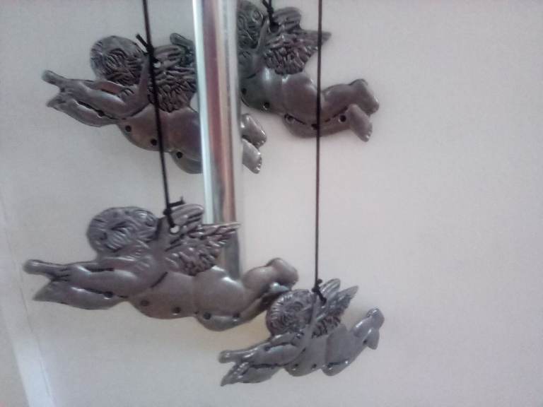 Cherub wall hangings and chimes. Brand new