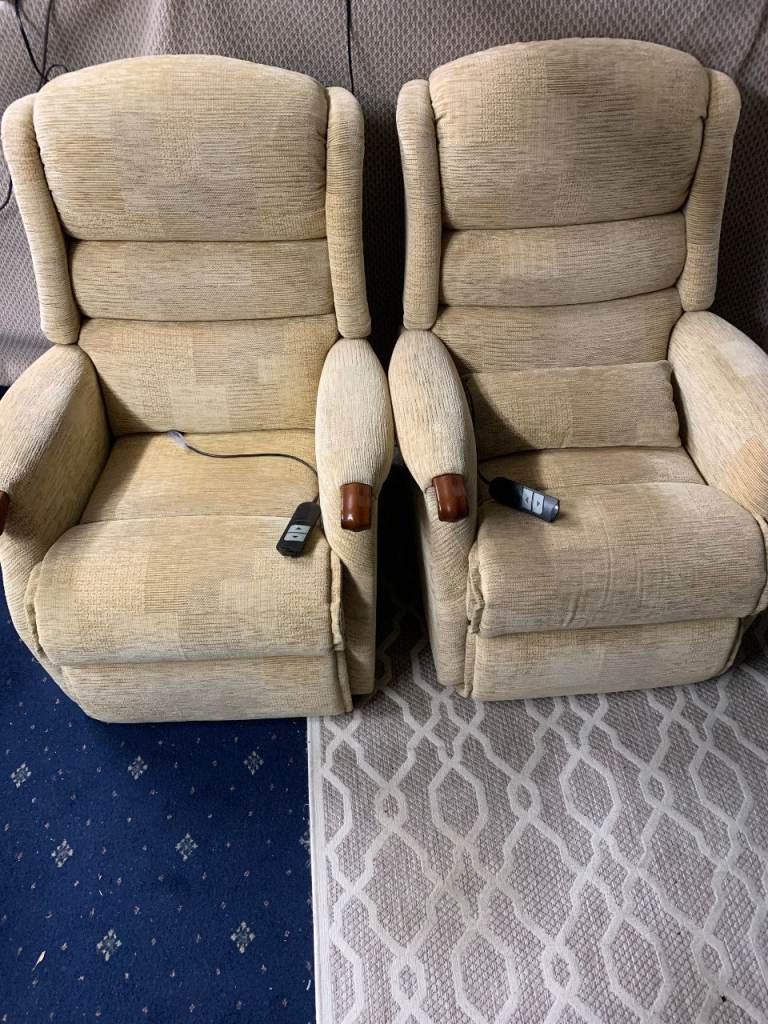 Two cream fabric armchairs can deliver locally