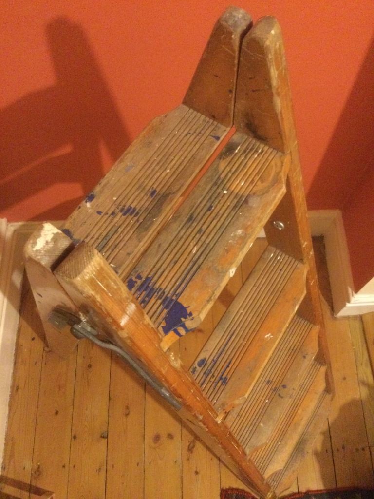 Old wooden step ladders . 