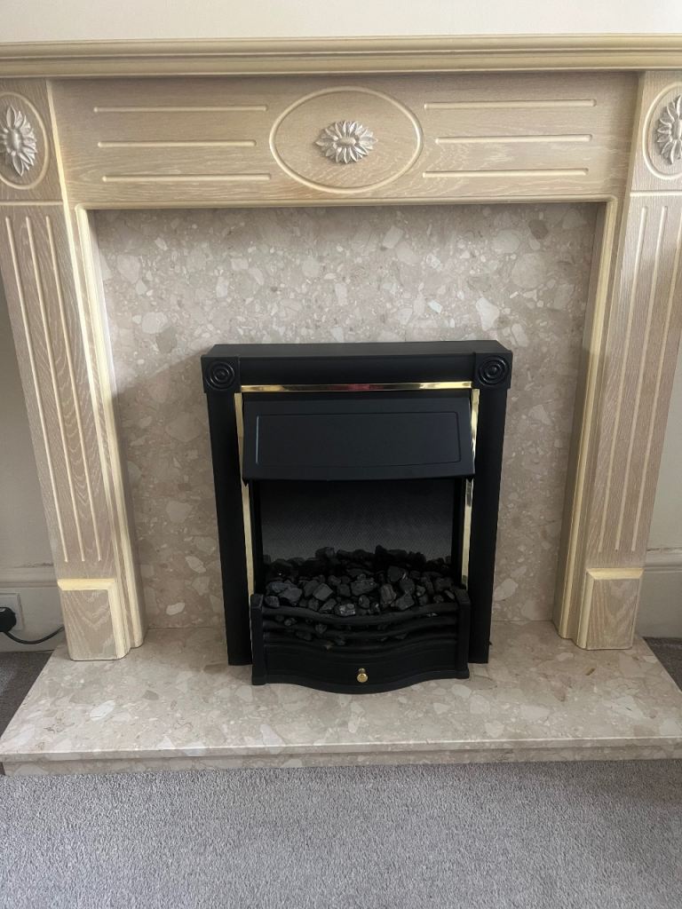 fireplace surrounds with marble backing and lined oak mantle  and hearth.