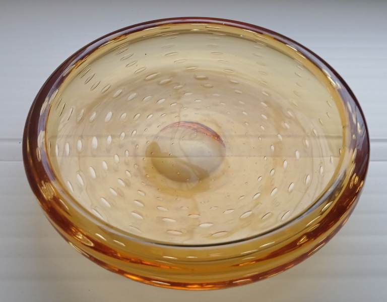 Whitefriars Controlled Glass Bubble Bowl in a golden amber color