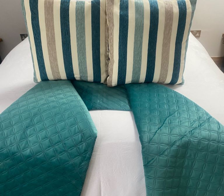 Bed throw and two matching cushion