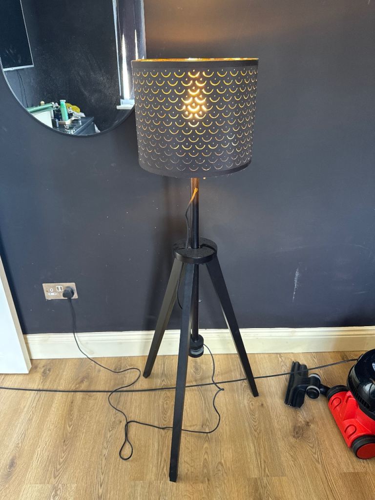 Stylish Black Tripod Floor Lamp with Gold Pattern Shade