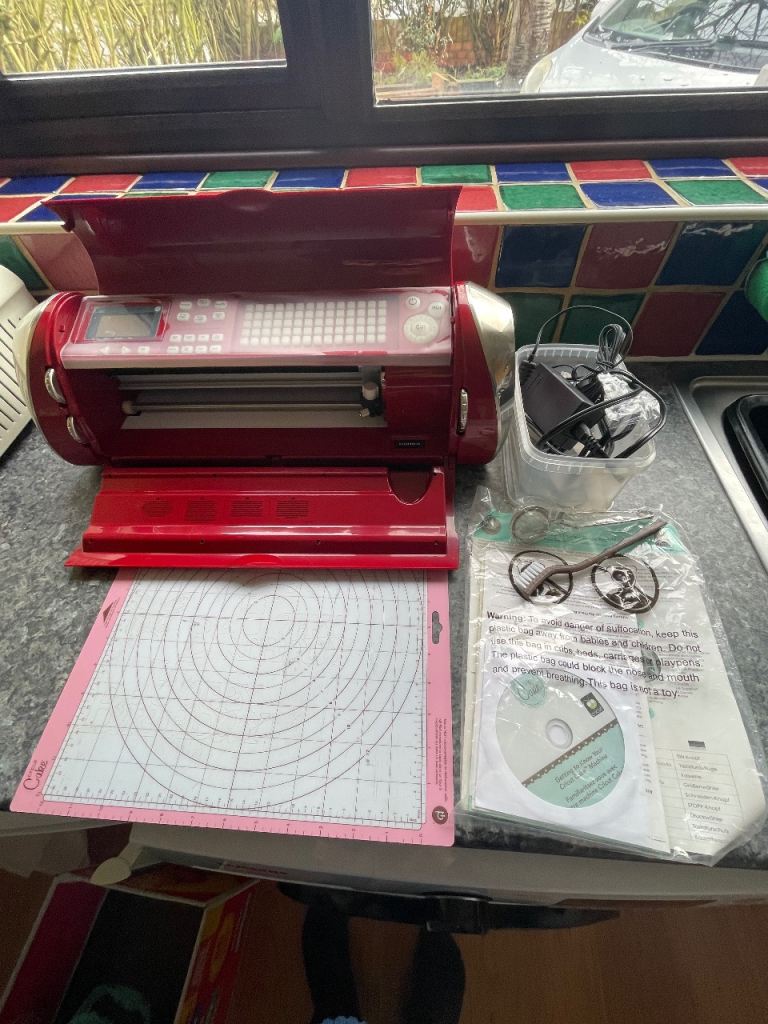 Cricut cake machine, cartridges and extras