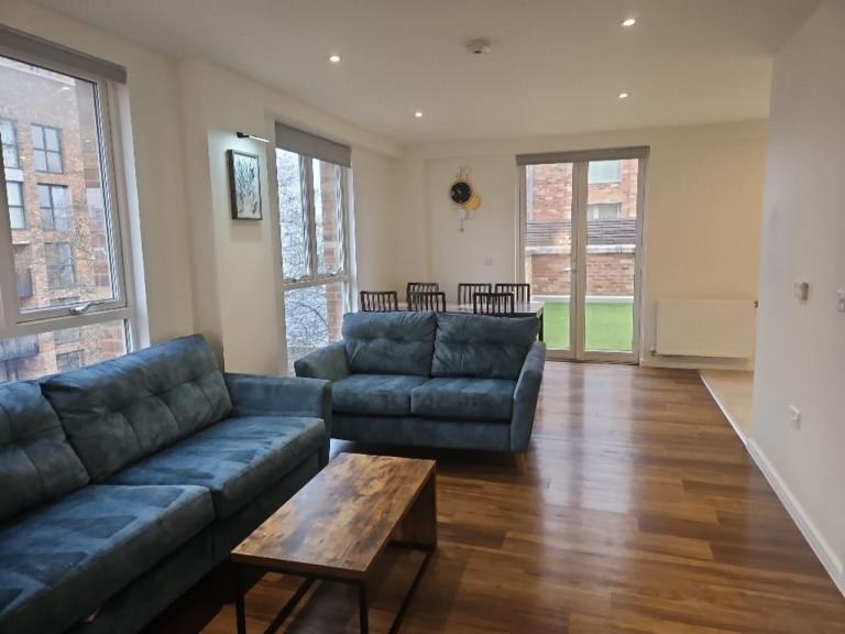 DFS french connection sofa set. 3 seater motorized recliner + 2 seater + storage ottoman