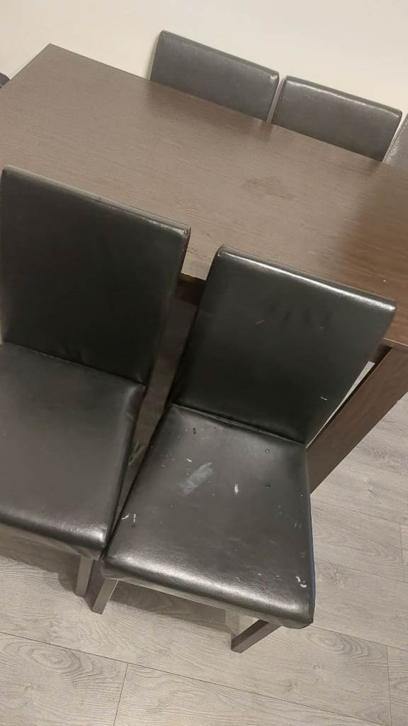 Dining Table and 4 Chairs - Dark Wood and Black Faux Leather. Free just arrange the pick up