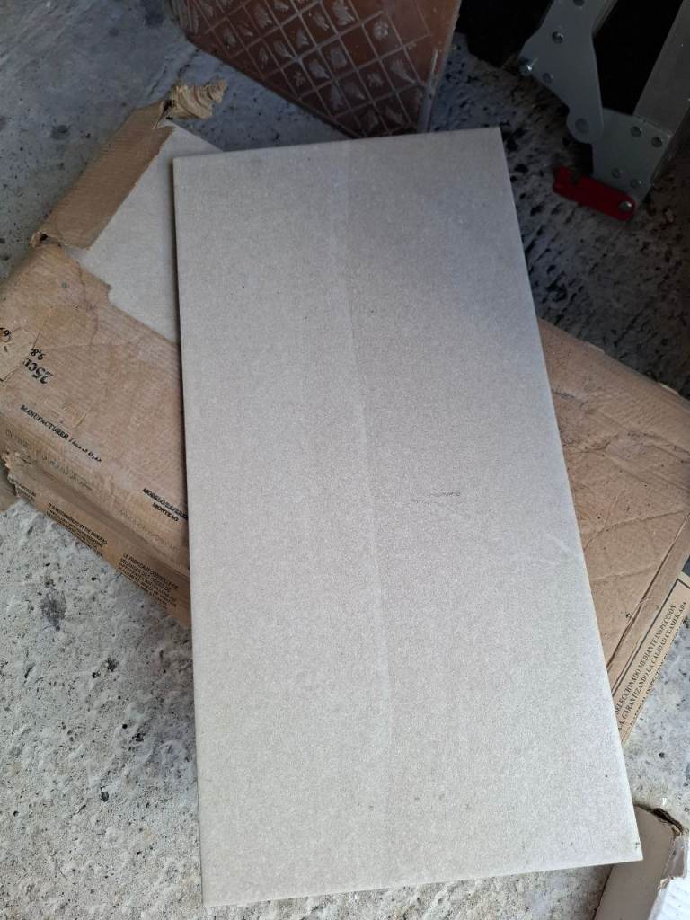 15 unused wall tiles.  
