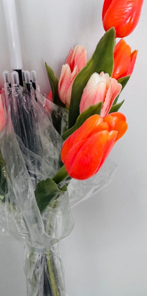 Bouquet of artificial tulip in umbrella 