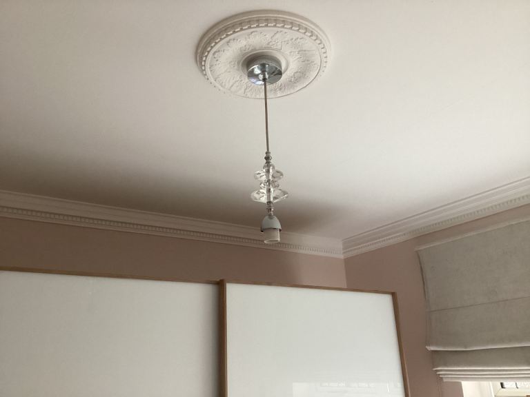 Light fitting includes lamp holder and ceiling rose